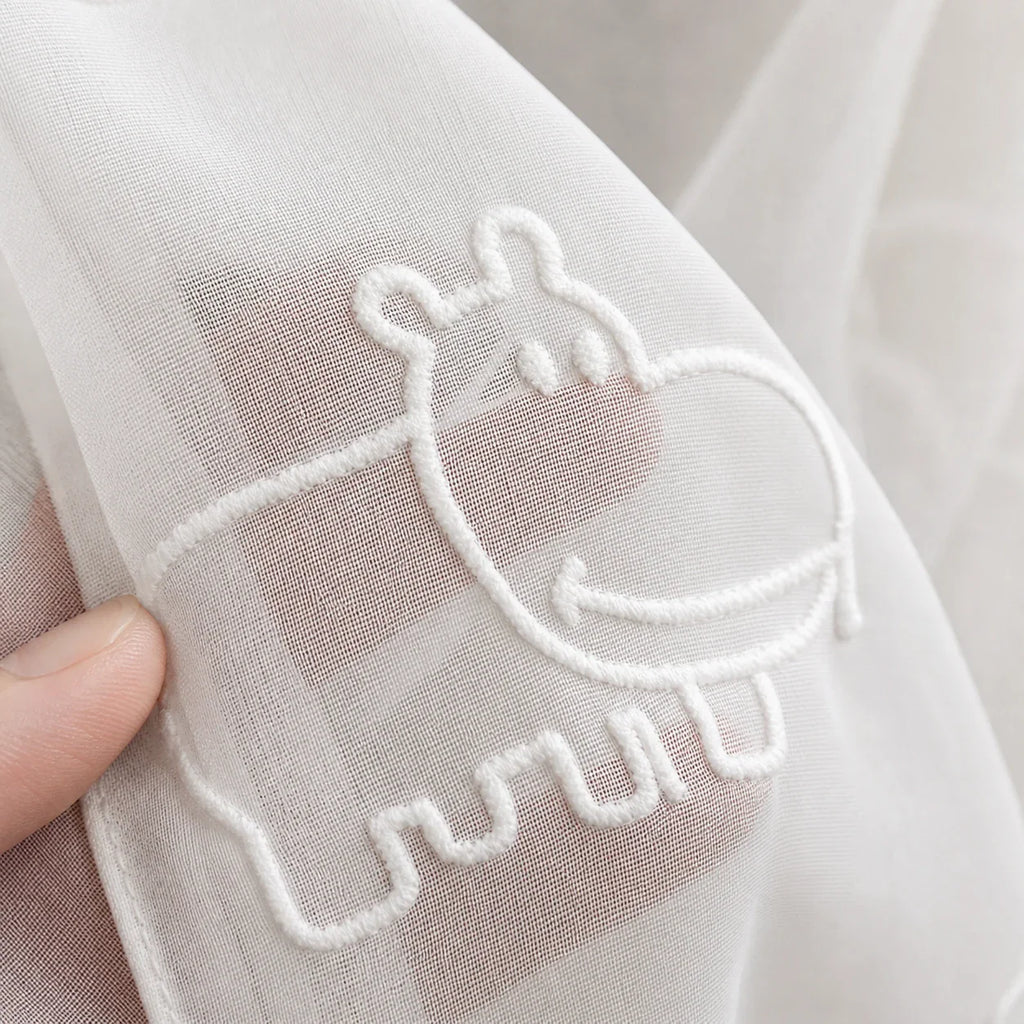 Voilage à motifs animaux - détail de texture du tissu voilage